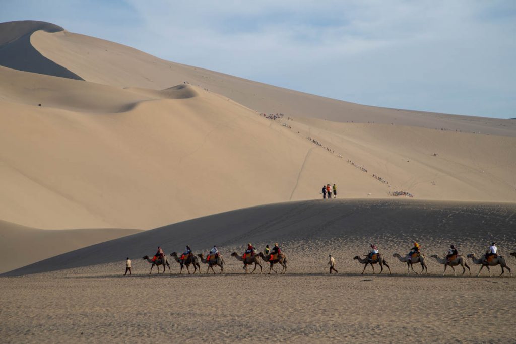 China, Dunhuang, Crescent lake with the singing sand dunes (00:04:36) High-Quality Images & Videos The MCA Collection