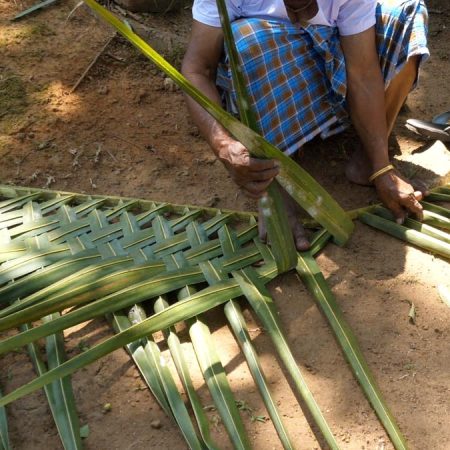 India, Kerala - Kochi -Traditional - Preparation of walls from tree branches to a shed