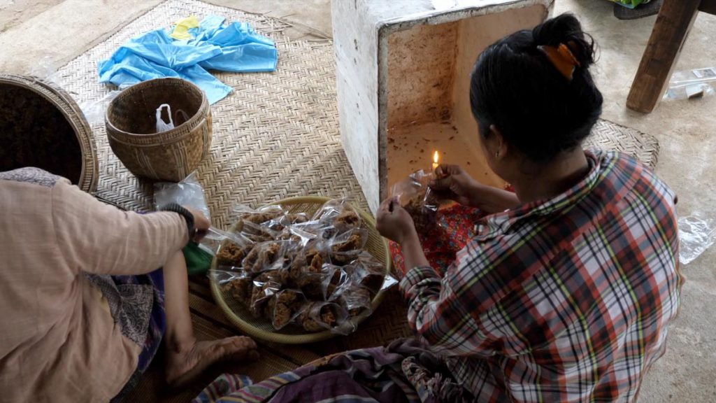 Myanmar, traditional – Packaging of snacks from plam sugar, ginger and coconuts sweet High-Quality Images & Videos The MCA Collection